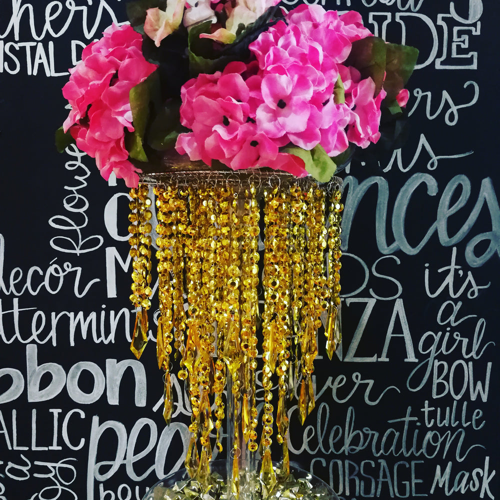 gold chandelier with hydrangea centerpieces