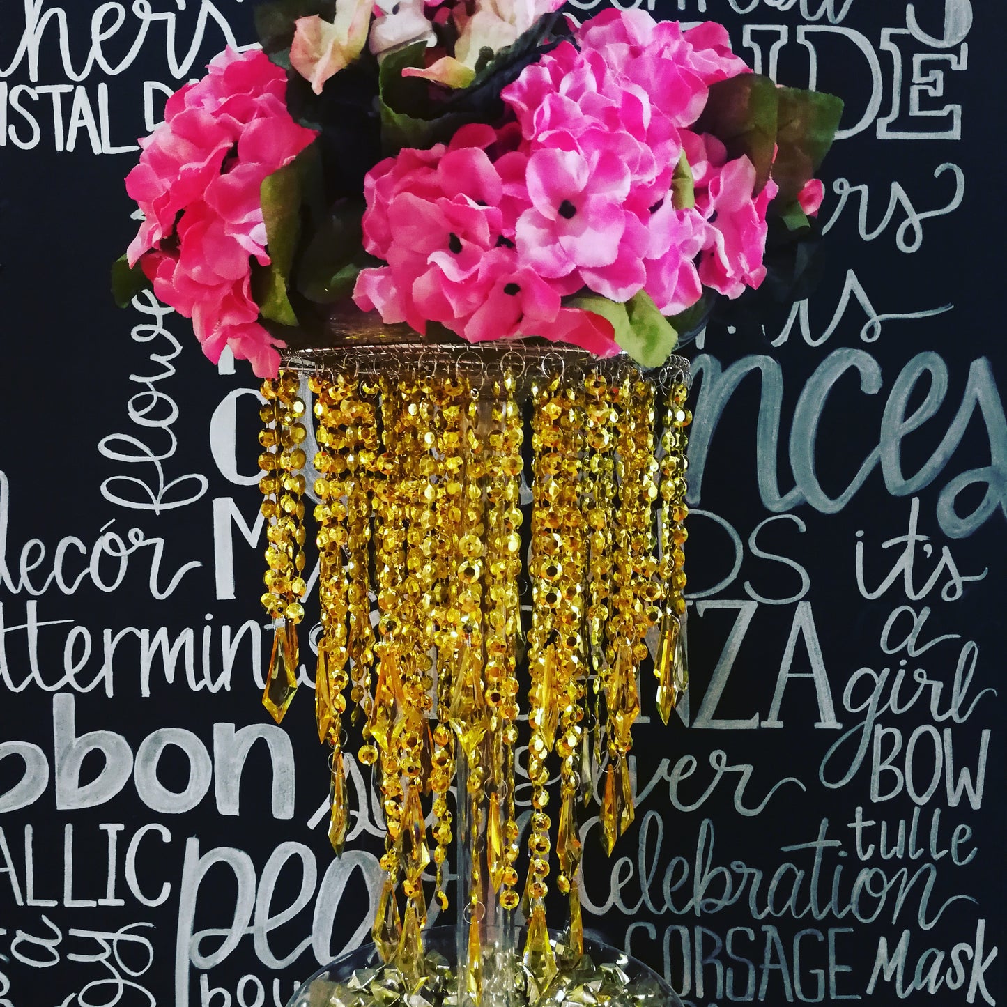 gold chandelier with hydrangea centerpieces